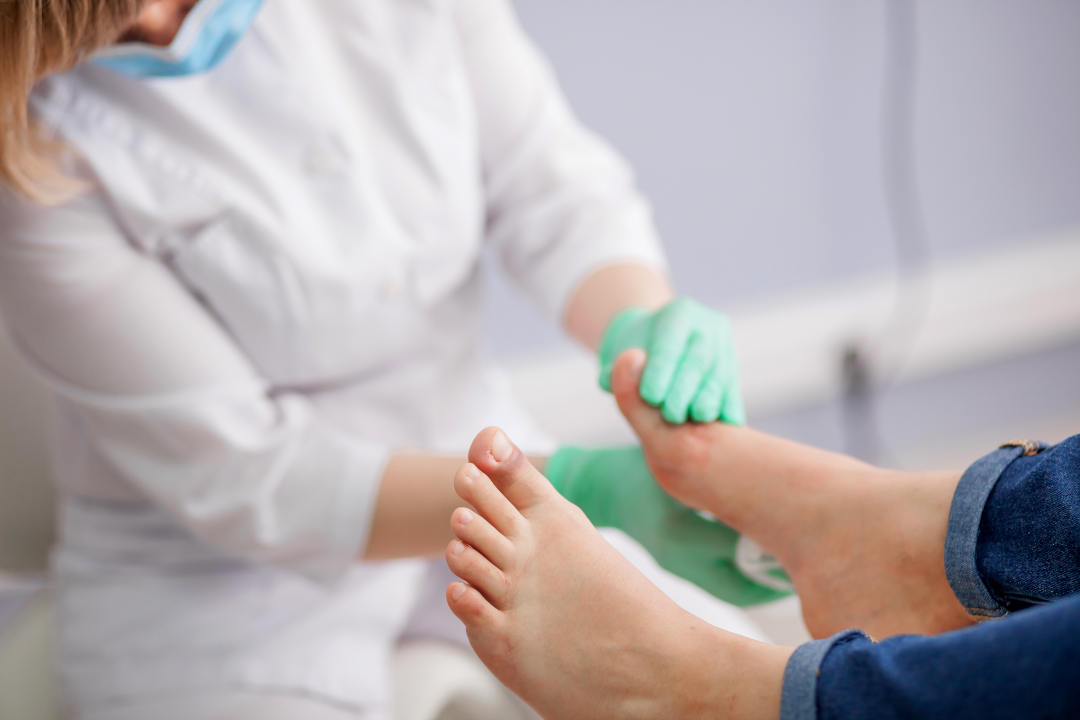 Podiatrist examining a foot